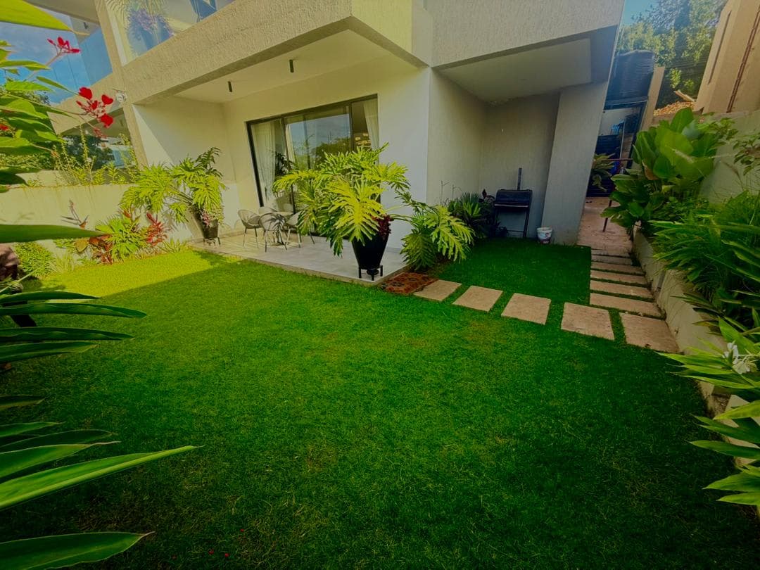 Villa garden lawn and outdoor terrace